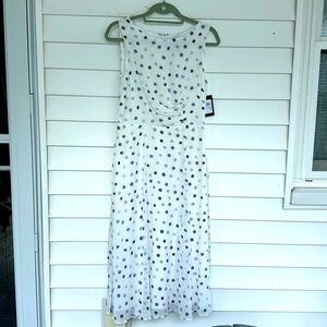 Dress. Never worn, size 6 white with blue pattern